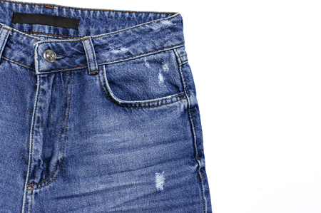 Blue jeans isolated on white background top view flat lay. Detail of nice blue jeans. Jeans texture or denim background. Trend clothing. Beauty and fashion, clothing conceptの写真素材
