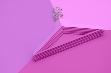 Creative fashion concept. Flat lay top view colored wooden hangers on pink background minimalism style pop-art. Sale discount store shopping concept, design empty hanger. Beauty feminine blog.の写真素材