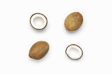 Fresh coconut on light gray background flat lay style Top View Copy Space. Pattern with ripe coconuts. Pop art design, creative summer and food concept. Tropical fruit whole half abstract background.の写真素材