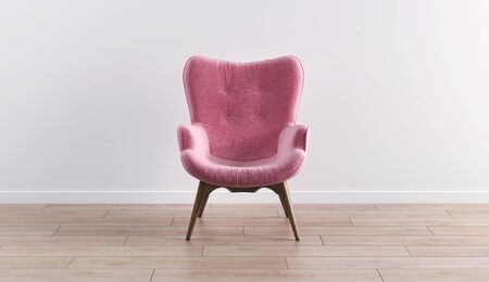 Fashionable modern pink armchair with wooden legs against a white wall in the interior. Furniture, interior object, modern designer armchair. Stylish minimalist interior.の写真素材