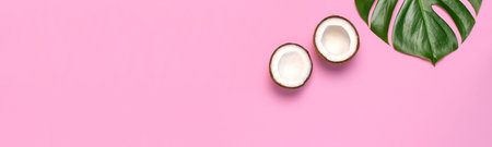 Tropical leaves and fresh coconut on pink background. Flat lay, top view, copy space. Summer...
