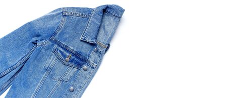 Close-up Blue denim jacket on isolated white background top view flat lay copy space. Denim, fashionable jacket, women's or men's trend clothing, fashion background. Store concept, sale.の写真素材