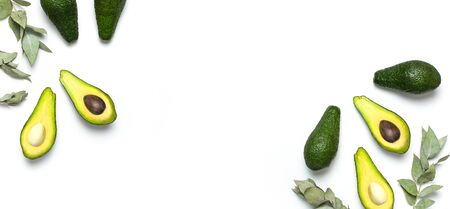 Ripe fresh avocado, eucalyptus twigs isolated on white background with shadow top view Flat lay copy space. Fruits Healthy food concept, diet, healthy lifestyle, organic avocado.の写真素材