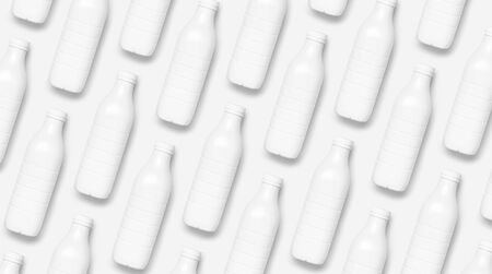 Pattern of white plastic bottle containers for dairy products on light gray background top view flat lay. Plastic Kefir Yogurt Milk Bottle. Packaging template mockup. Layout for your design.の写真素材