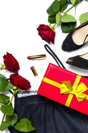 Female black T-shirt jacket with lace, classic shoes, gift box, red lipstick and rose flowers on white background top view flat lay copy space. Beauty fashion background. Sexy clothes, women's holiday.の写真素材