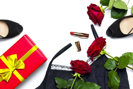 Female black T-shirt jacket with lace, classic shoes, gift box, red lipstick and rose flowers on white background top view flat lay copy space. Beauty fashion background. Sexy clothes, women's holiday.の写真素材