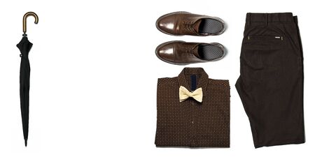 Flat lay set Men's classic clothing, blazer jacket pants shirt bow tie leather shoes isolated items on white background top view. Male fashion, office wear, business style, concept of sales.の写真素材