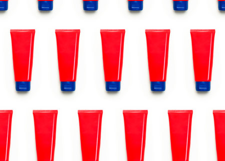 Seamless Pattern of Red clean empty tube of cream or gel for hands face body on white background....