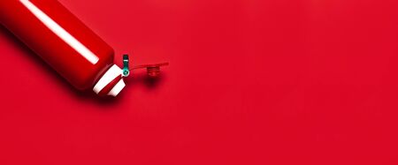 Metallic red sports water bottle on red background top view flat lay copy space. Concept of drinking water, healthy lifestyle. Accessory for sports, travel, outdoor activities. Water container.の写真素材