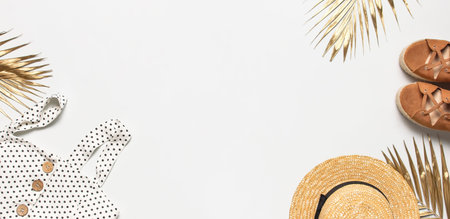 Summer women's white dress in black peas brown sandals straw hat golden palm leaf shells starfish on...