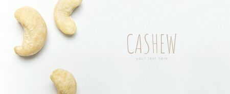 Creative food layout. Cashew on white background top view copy space. Concept of food, healthy nutrition, nut, healthy fats. Flat lay. Cashew pattern. Organic healthy vegan snack, macro shot.の写真素材