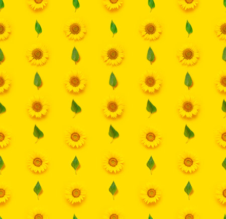 Flower Seamless pattern. Beautiful fresh sunflower with green leaves on yellow background. Flat lay,...