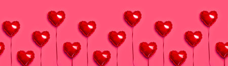 Seamless Pattern of Red balloon in the shape of heart on pink background top view flat lay copy space. love concept. Holiday Object, Birthday, Valentine's Day, Wedding. party decor. greeting card.の写真素材
