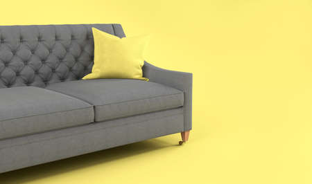 Modern scandinavian classic gray sofa with yellow, gray pillow on wooden legs on yellow background.の写真素材