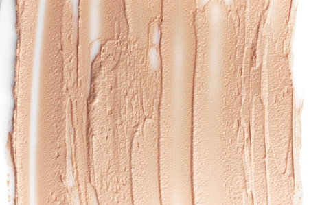 Texture of liquid foundation for face. Make-up, decorative cosmetics, beige foundation isolated on...