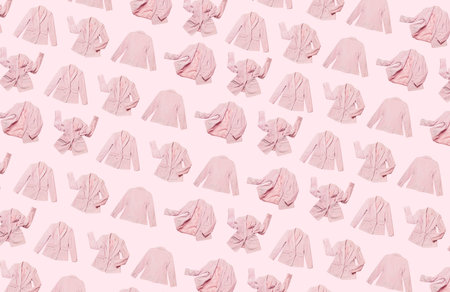 Pattern from womens fashionable flying pink blazer isolated on light pink background. Female...
