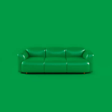 Green leather soft sofa on green background with shadow. Stylish cozy modern sofa made of genuine leather on wooden legs. Minimalistic interior room in green colors. single piece of furniture.の写真素材