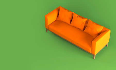 Modern scandinavian bright orange fabric sofa with soft pillows on wooden legs on green background flat lay view from above. Furniture, single piece of interior object. Stylish trendy couch.の写真素材