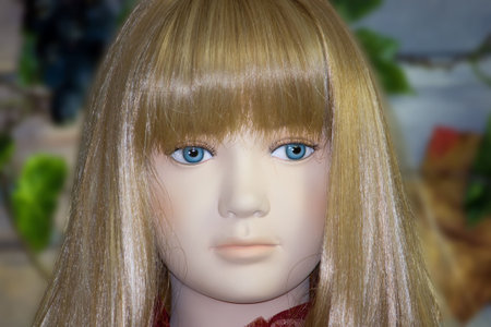The plastic model with the blue eyes, looking at youの写真素材