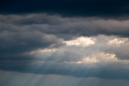 White clouds against the blue sky, a summer day in sunny weatherの写真素材