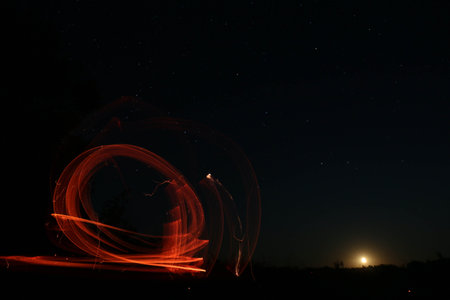 Starry sky and drawings with fire and lanterns long exposure, natural landscape, Ukraine