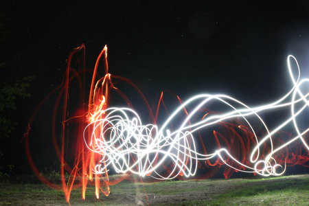 Starry sky and drawings with fire and lanterns long exposure, natural landscape, Ukraine