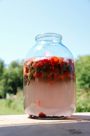 Preparation homemade refreshing strawberry and lime lemonade with mint