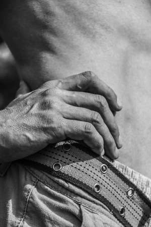 Male hands close-up Black and white image of a muscular man, athletic body, beautiful masculine forms of muscles, relief. Beautiful strong and flexible body, sexy attractive.の写真素材