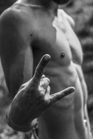 Male hands close-up Black and white image of a muscular man, athletic body, beautiful masculine forms of muscles, relief. Beautiful strong and flexible body, sexy attractive.の写真素材