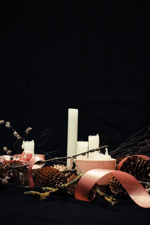 Pink Christmas decorations with candlelight, pink ribbons, twigs, dry grass, including sparkling...
