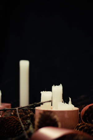 Pink Christmas decorations with candlelight, pink ribbons, twigs, dry grass, including sparkling...