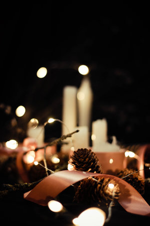 Pink Christmas decorations with candlels on a black background