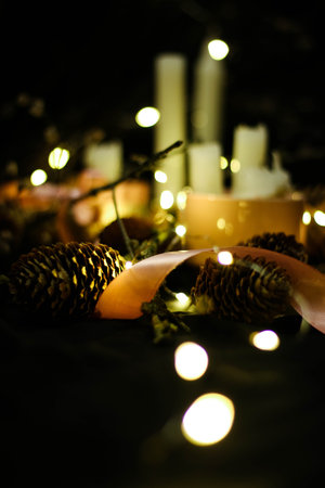 Pink Christmas decorations with candlels on a black background