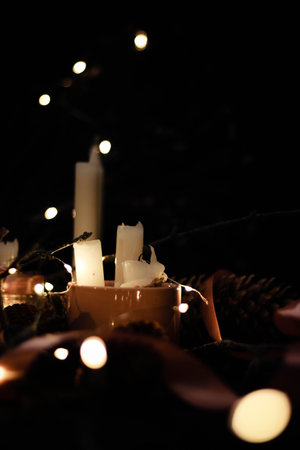 Pink Christmas decorations with candlels on a black background