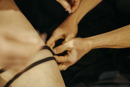 Submission slave woman legs bound in erotic fashion style rope shibari kinbaku Japanese bondage knot. Bdsm sadomasochism mistress master dominant fetish punishment flogging sadism masochism concept.の写真素材