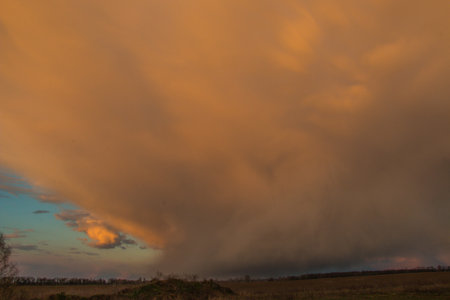 Beautiful sunset and dramatic clouds in the sky. Reflected in the waters of the lake. Beautiful natural background.の写真素材