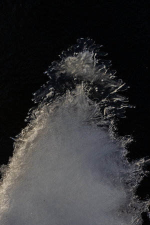 frosty ice over water. Winter Cold River, due to which ice, icicles, patterns formed. Sunny day, glare, radiation. Beautiful natural background, natural texture.の写真素材