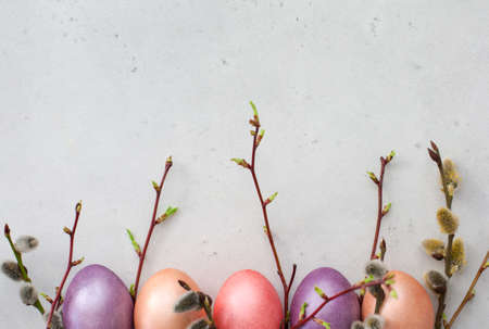 Easter eggs painted in pastel colours background.の写真素材