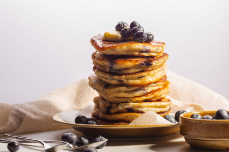 Homemade pancakes with ricotta and blueberries. Whitet background. Copy space.