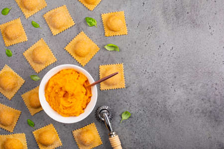 Raw tortelli with pumpkin filling. Pumpkin filling made from baked pumpkin, egg, bread crumbles, nutmeg. Traditional italian recipe.の写真素材