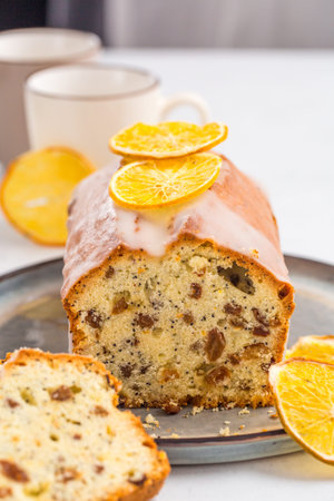 Plumcake with raisins, orange zest and poppy seed. Homemade. Vertical image.