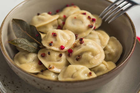 Homemade pelmeni - russian dumplings with minced meat: pork and beef. Closeup.の写真素材