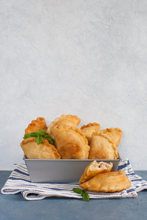 Homemade panzerotti - southern italian fried turnover. With mozzarella and mortadella filling....