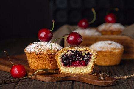 Homemade mini pies with cherry and blackcurrant feeling. Baked in a Muffin Tin.