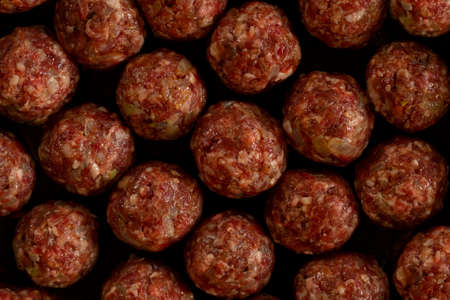 Cooking  rice meatballs or Porcupine Meatball, made with ground beef, rice, onion. Background.の写真素材