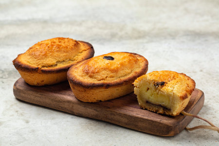 A Pasticciotto, small Italian cake, filled  with egg custard cream. Called also pusties. Traditional...
