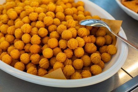 Fried potato croquettes. Snack, potato balls, close up.