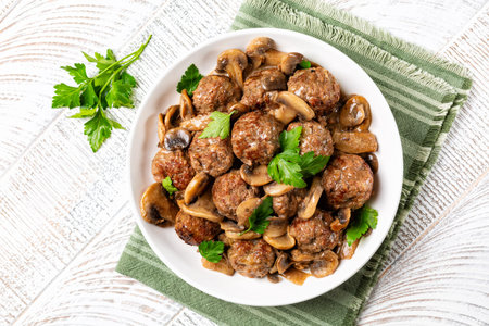 Swedish beef meatballs with mushroom and gravy. Top view of a plate.