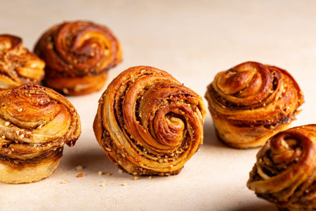 Homemade cruffins, a hybrid of a croissant and a muffin, filled with mix of butter, brown sugar and...