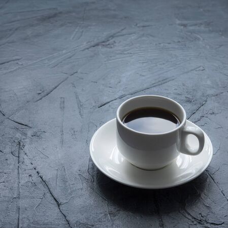 fresh espresso on white cup gray concrete background morning lightの写真素材